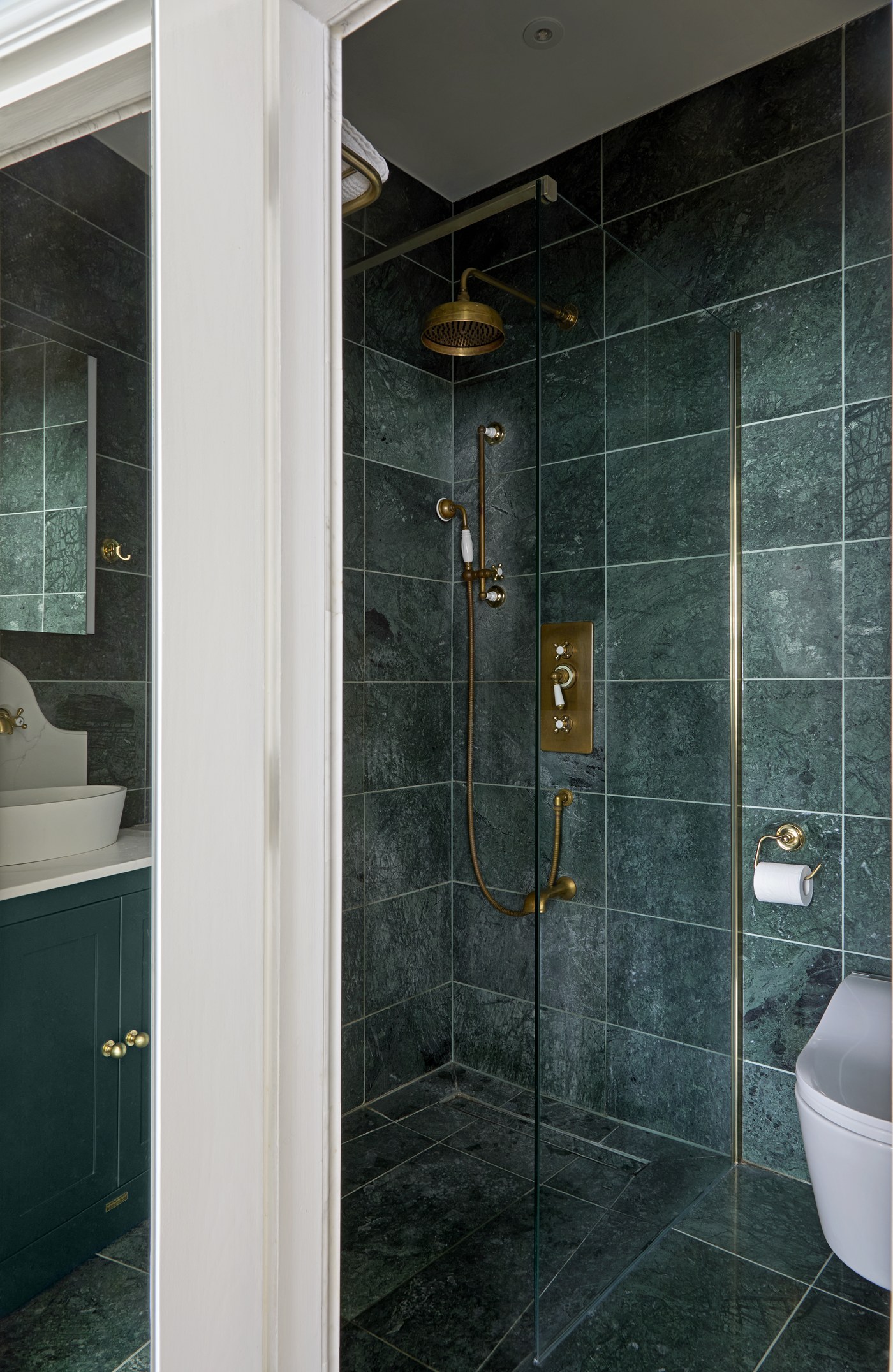 Green marble shower enclosure with brass fittings at Achilles Road