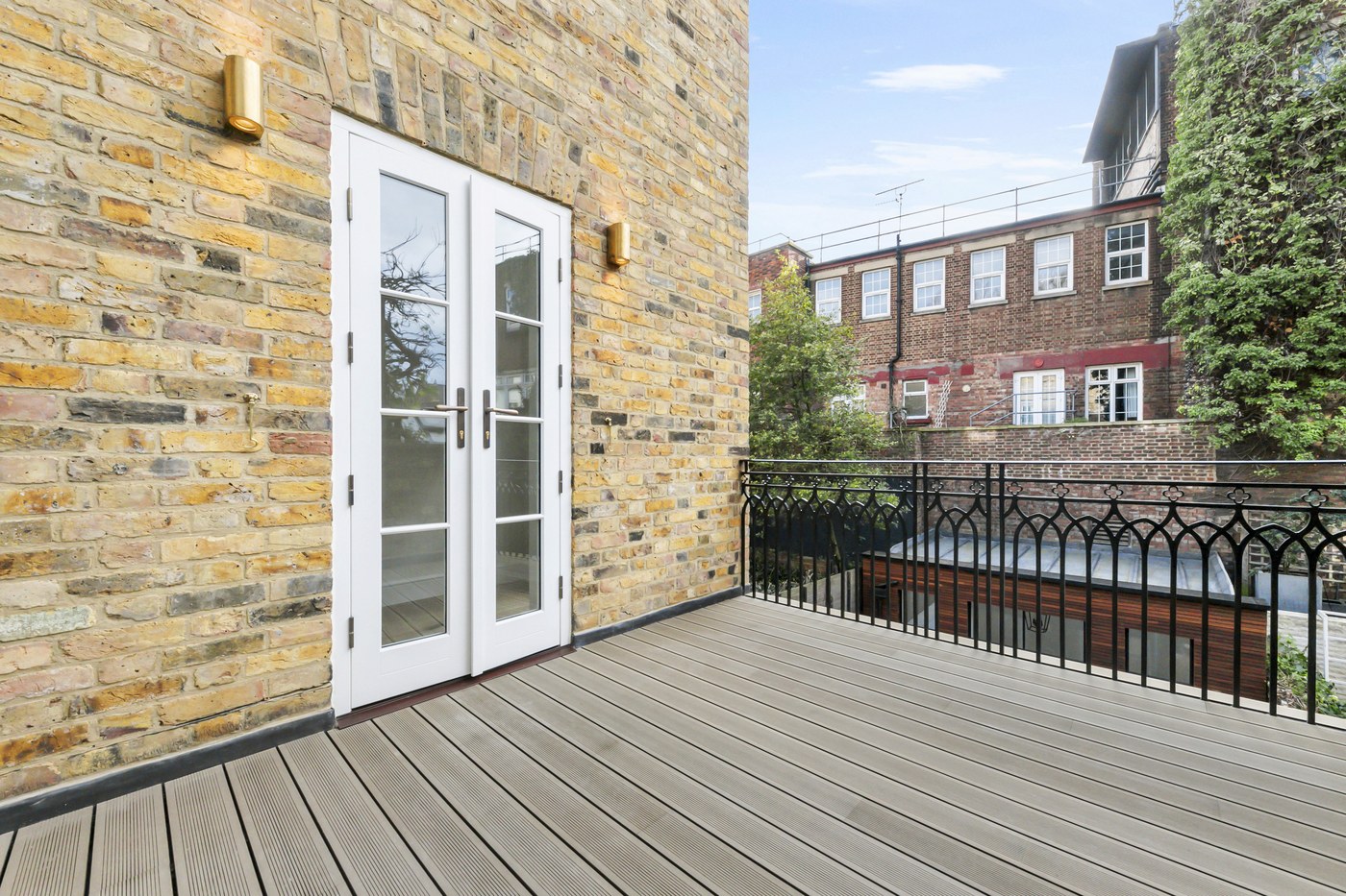 Timber-decked terrace at Brompton Square with new external doors to the house
