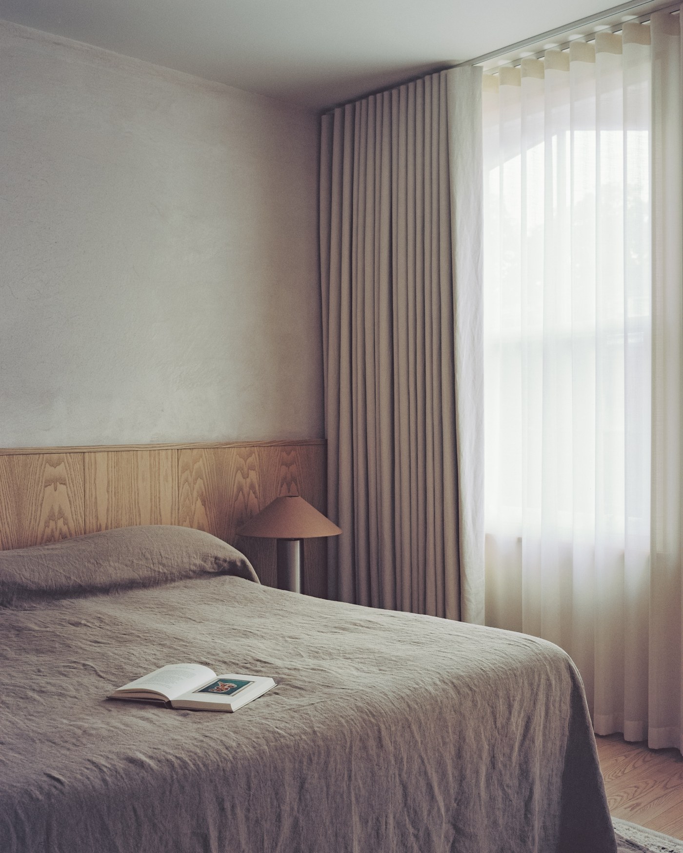 Caithness Road W14 — bedroom with ash panelling to dado height and full-height curtains