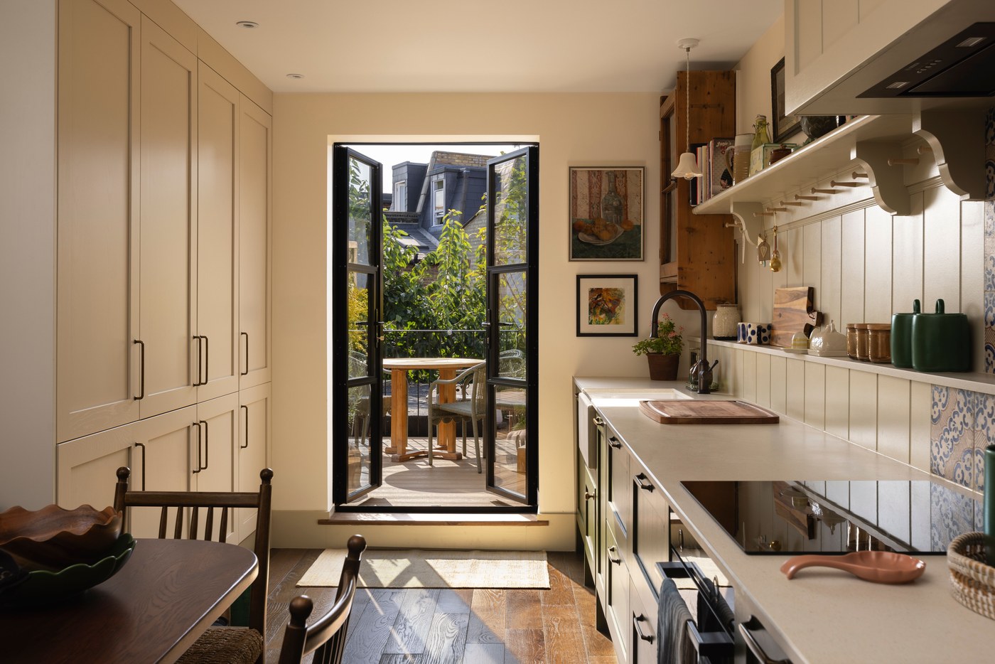 Galley kitchen at Garratt Lane with doors opening to the balcony