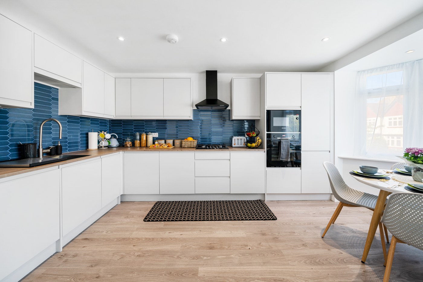 New apartment kitchen at Millway with blue tiled splashback